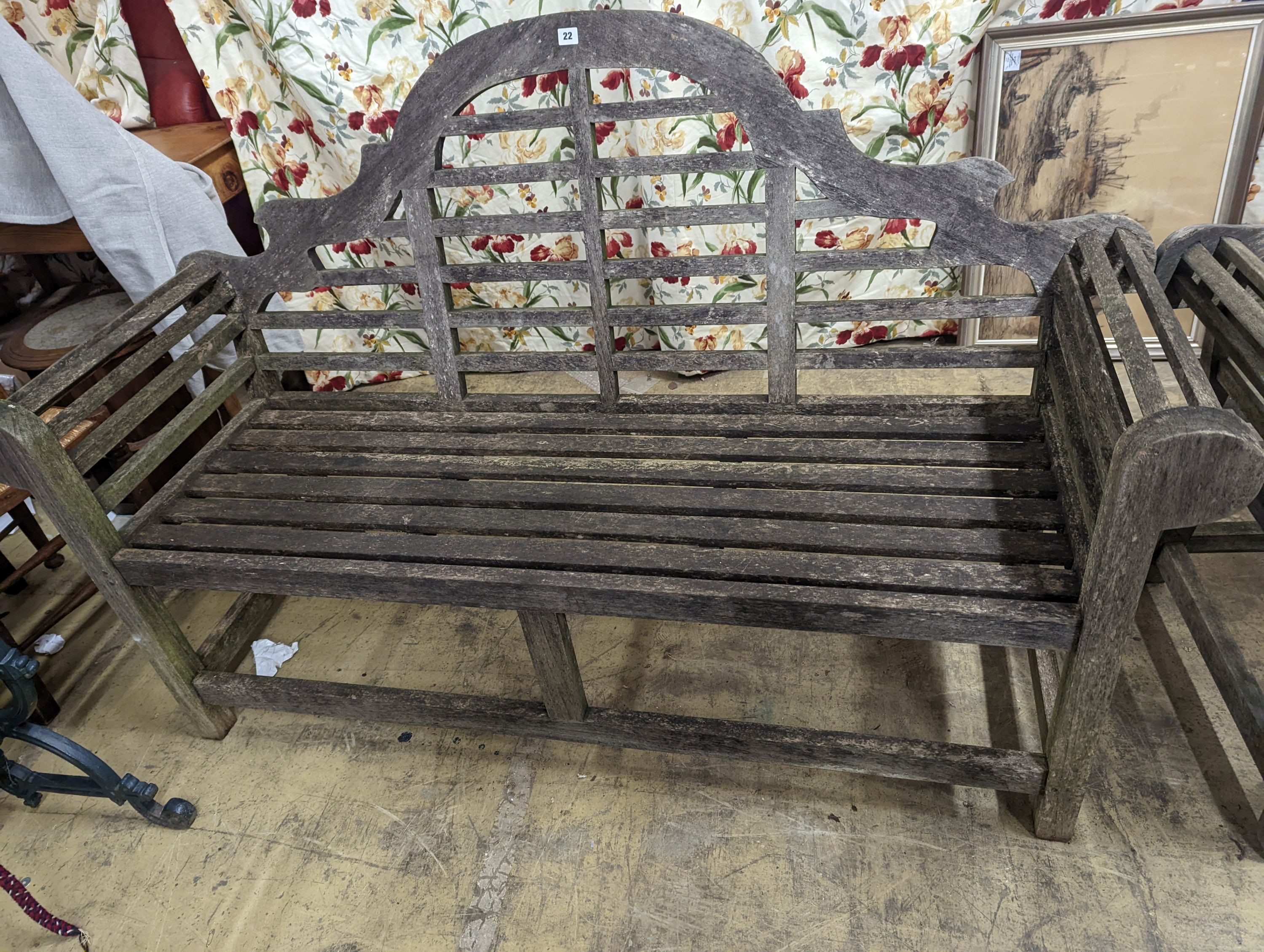 A pair of Lutyens style weathered teak garden benches, length 166cm, depth 53cm, height 105cm